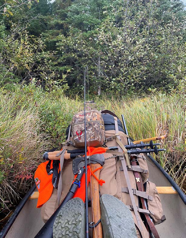 Canoe filled with essential moose hunting gear