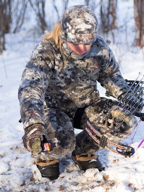 hunter dressed in layered gear for cold weather hunting