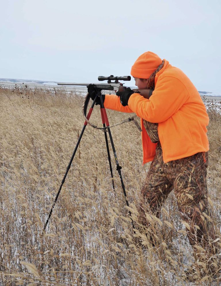 hunter with shooting tripod