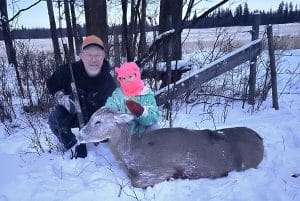 Author and daughter with their deer