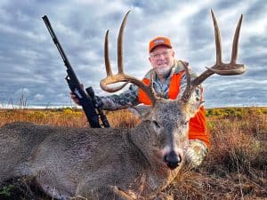 Author wiht a great buck taken with a Traditions NitroBolt Muzzleloader