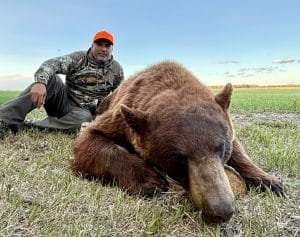 Sergio with a gorgeous cinnamon-colored black bear.