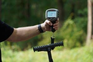 Author performing weight test for climbing sticks