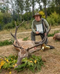 Author with his harvested red stag and certificates