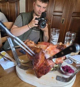 Enjoying traditional pork knuckles during the Slovakia trip