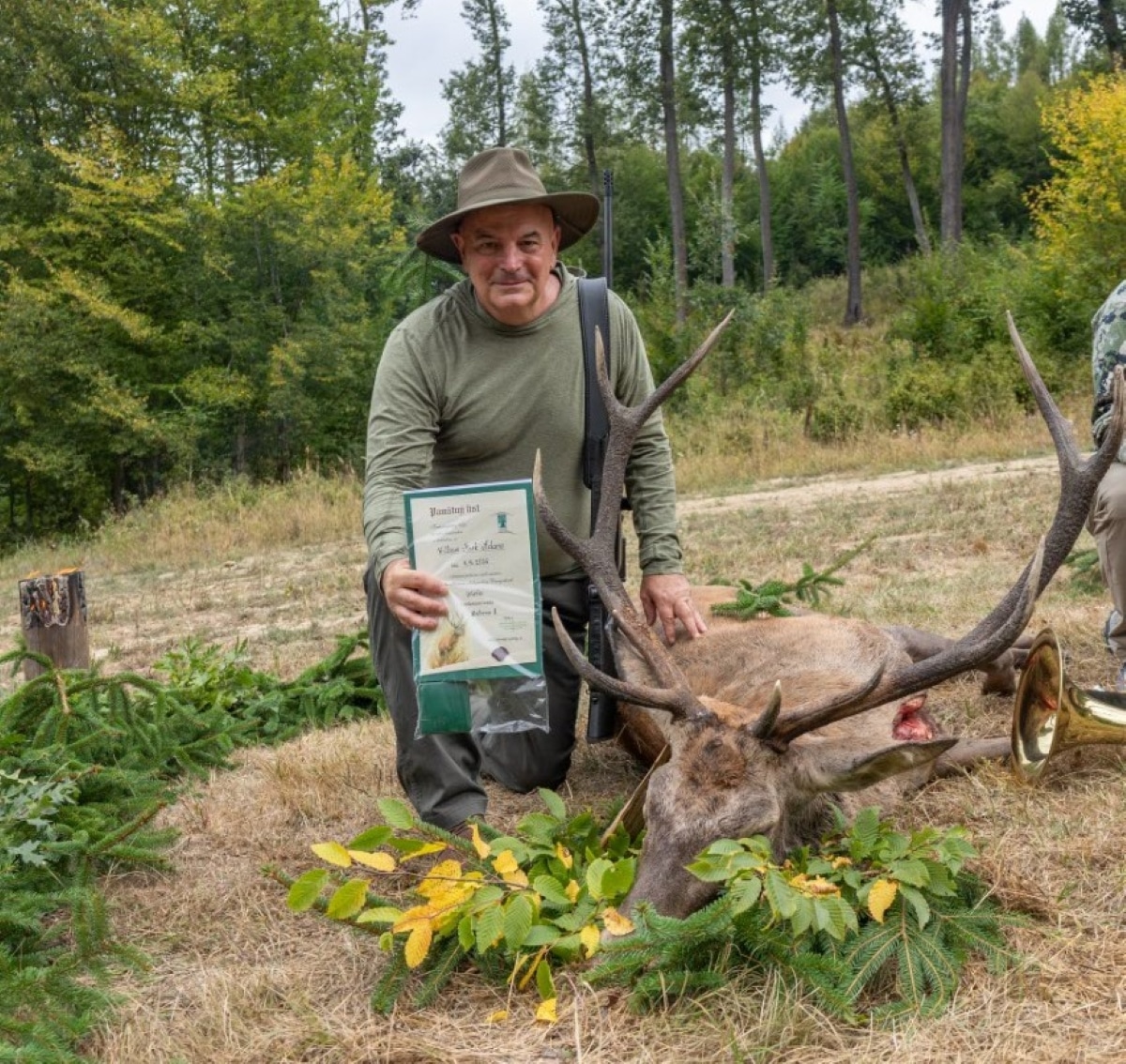 Author posing with his stag and the certificates2