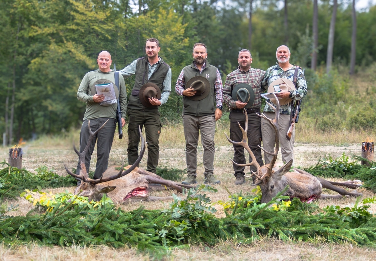 Hunters guides and outfitter Roman Valent pose with stags